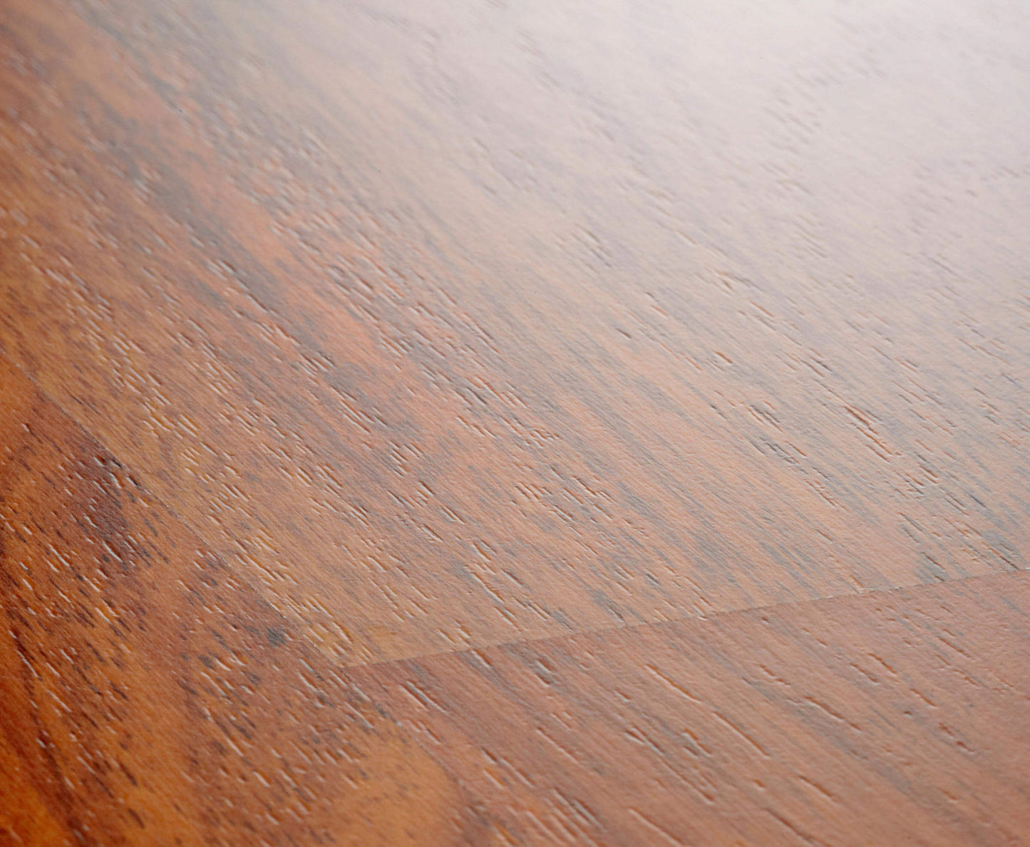 Close-up of a wooden surface with a gradient from brown to gray.