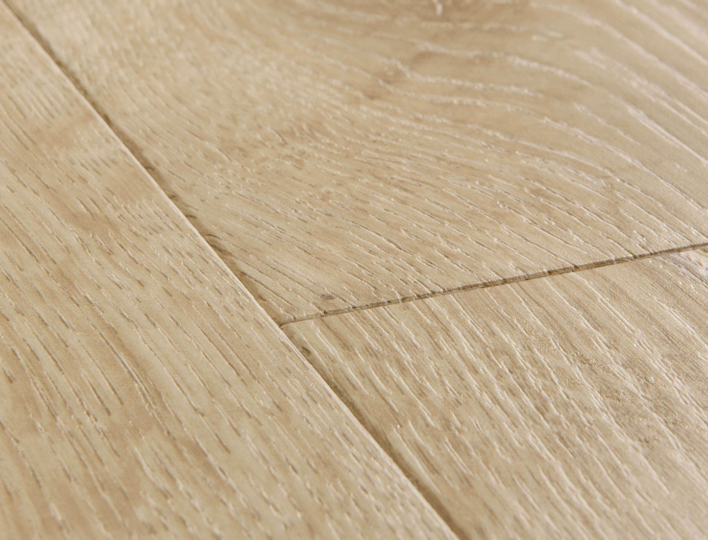 Close-up of a wooden floor with visible grain and texture