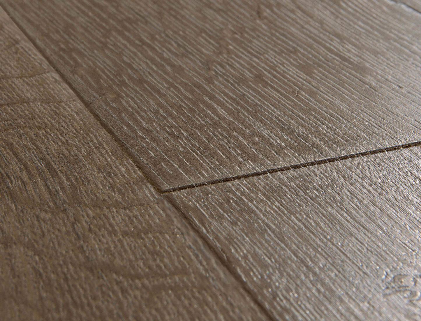 Close-up of a wooden floor with a visible grain pattern