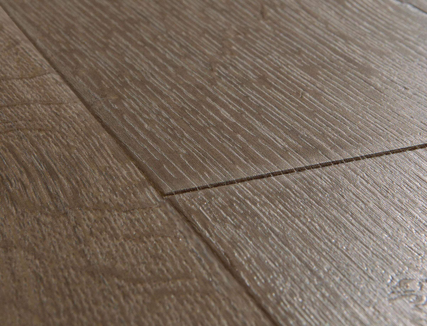 Close-up of a wooden floor with visible grain and texture