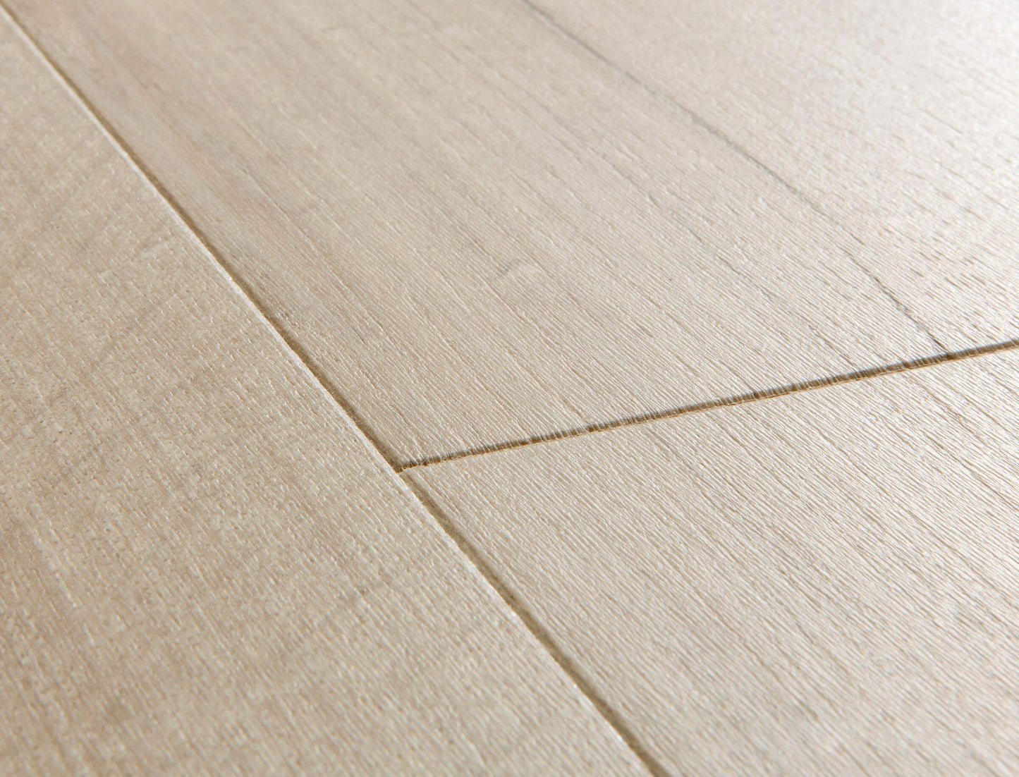 Close-up of light wood flooring with a clear finish