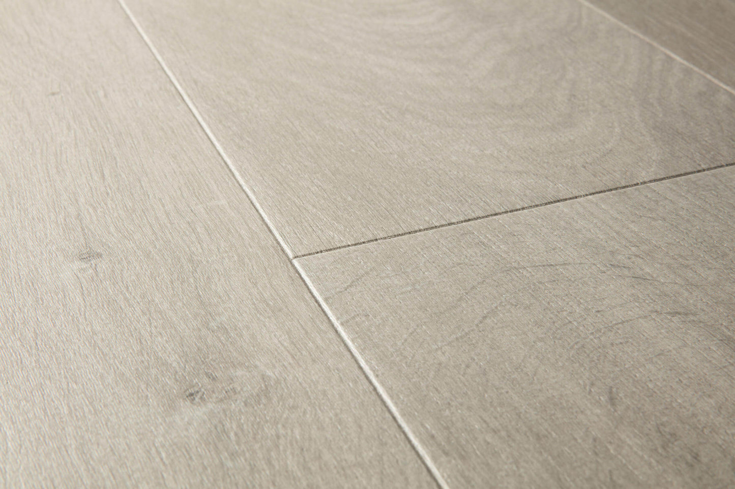 Close-up of light gray tiles with a wood-like texture
