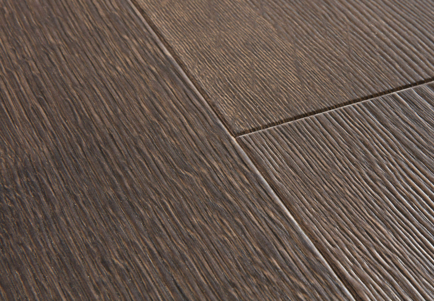 Close-up of dark wood flooring with visible grain and texture