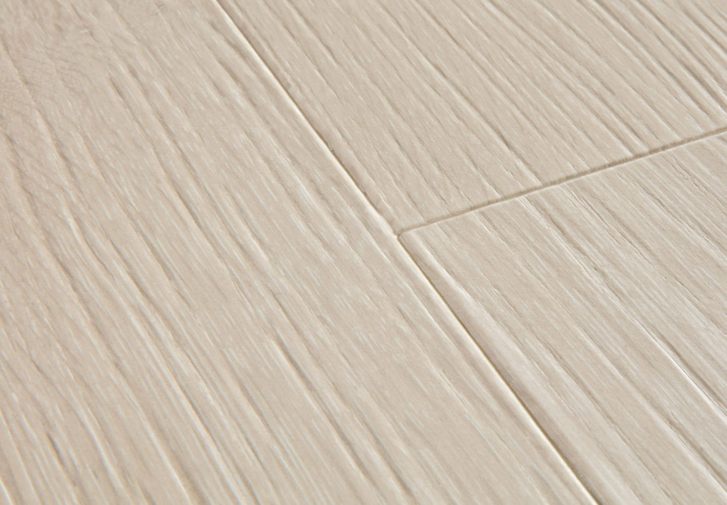 Close-up of a tiled floor with beige tiles