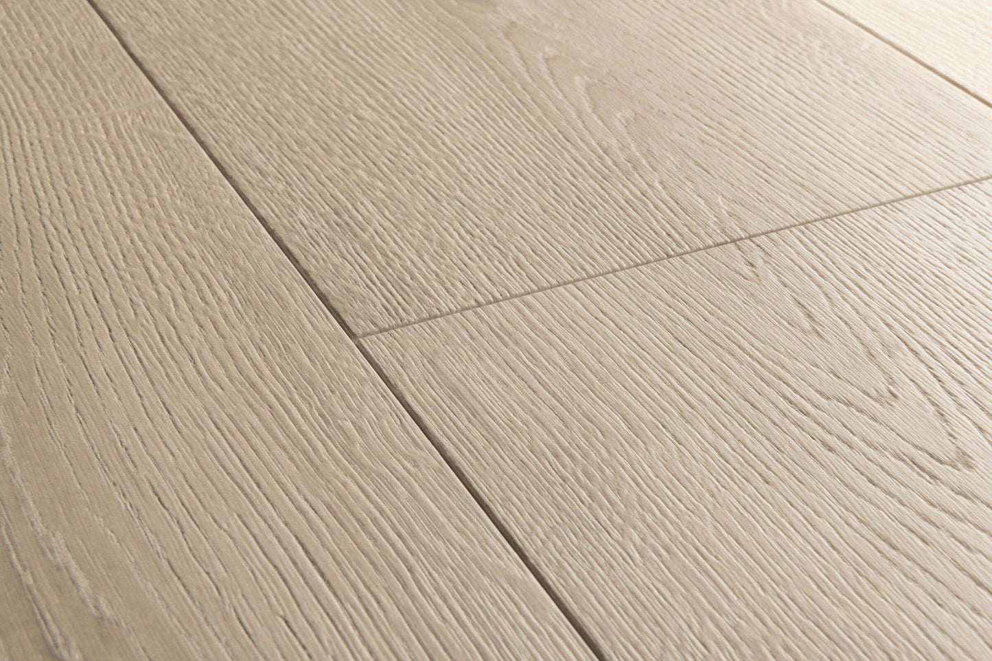 Close-up of a wooden floor with light brown planks.