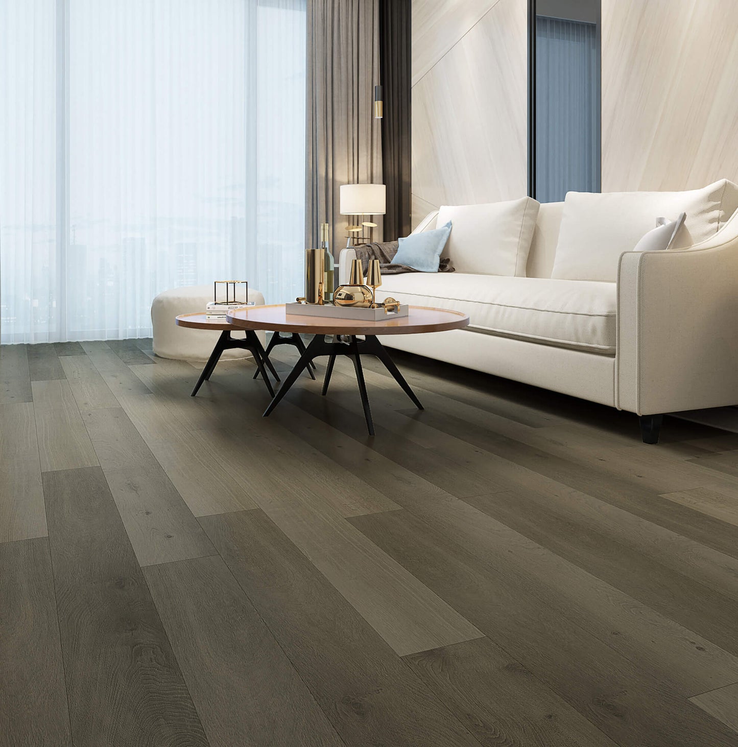 Modern living room with a white sofa, wooden coffee table, and large windows.
