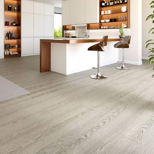 Modern kitchen with wooden flooring and bar stools.