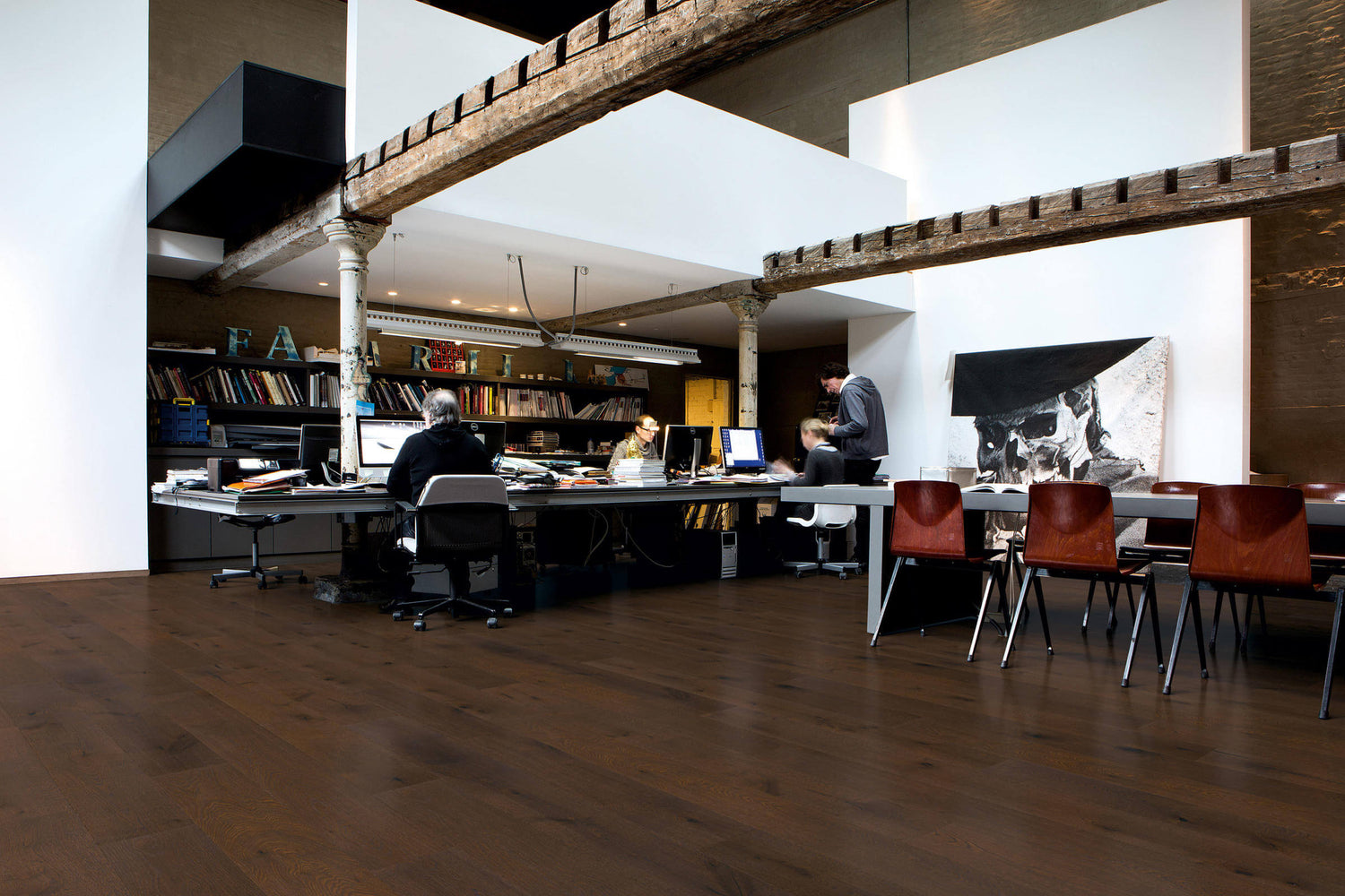 Modern office space with wooden floors and exposed beams