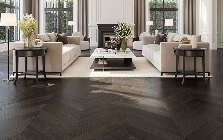 Modern living room with beige sofas, coffee table, and decorative elements.