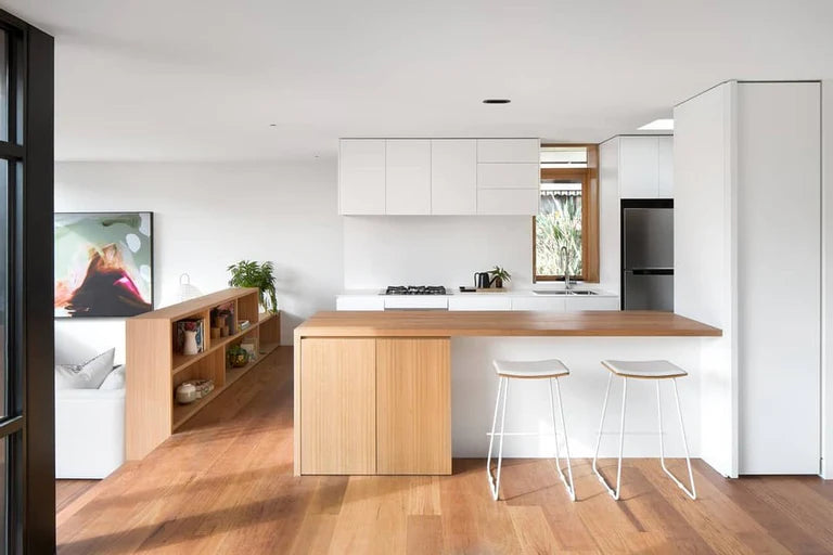 Modern kitchen with wooden island and white cabinets