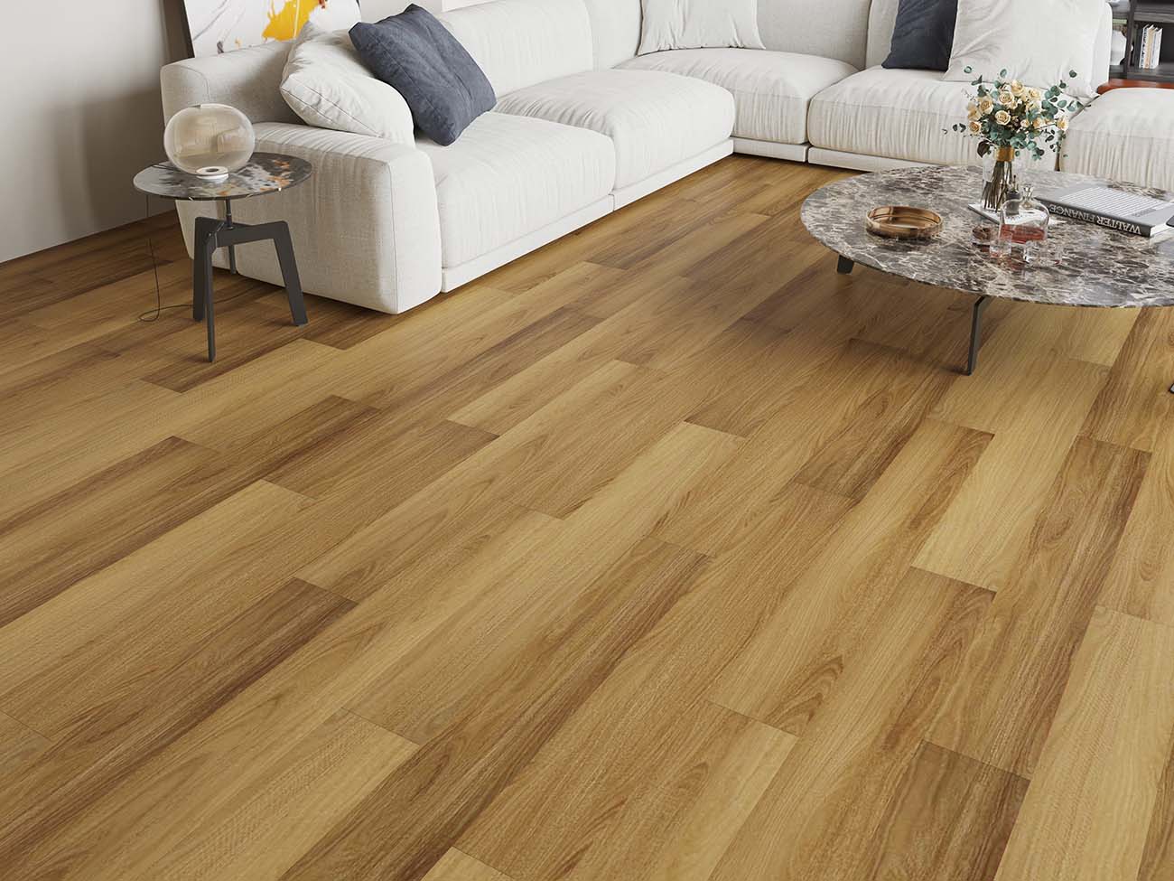 Wooden flooring in a living room setting with a couch and coffee table.