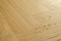 Wooden floor with water droplets on a light wood background