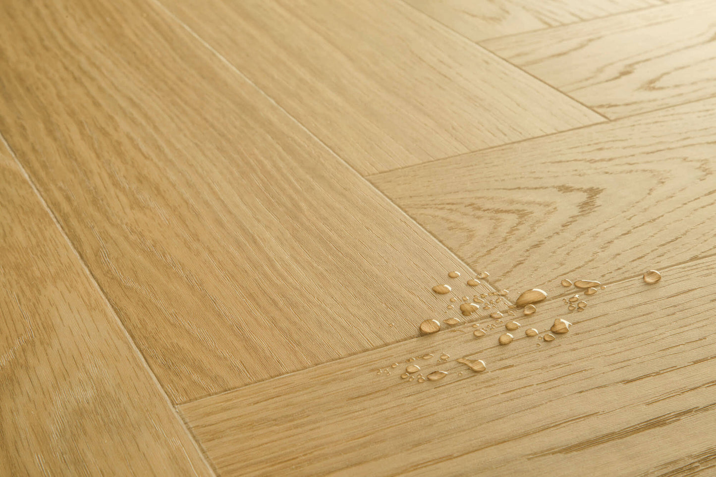 Wooden floor with water droplets on a light wood background