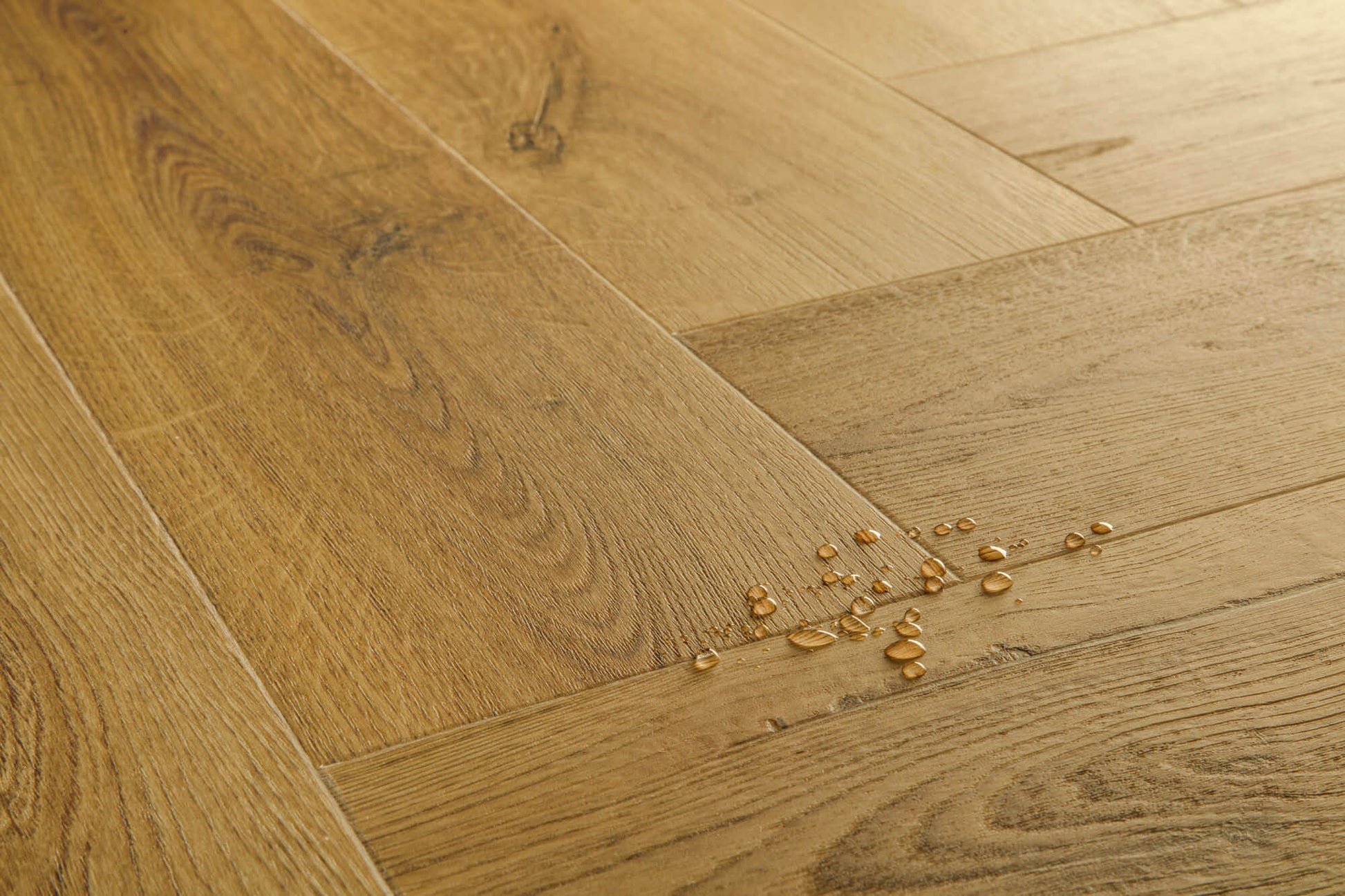 Close-up of wooden flooring with a few small objects on it