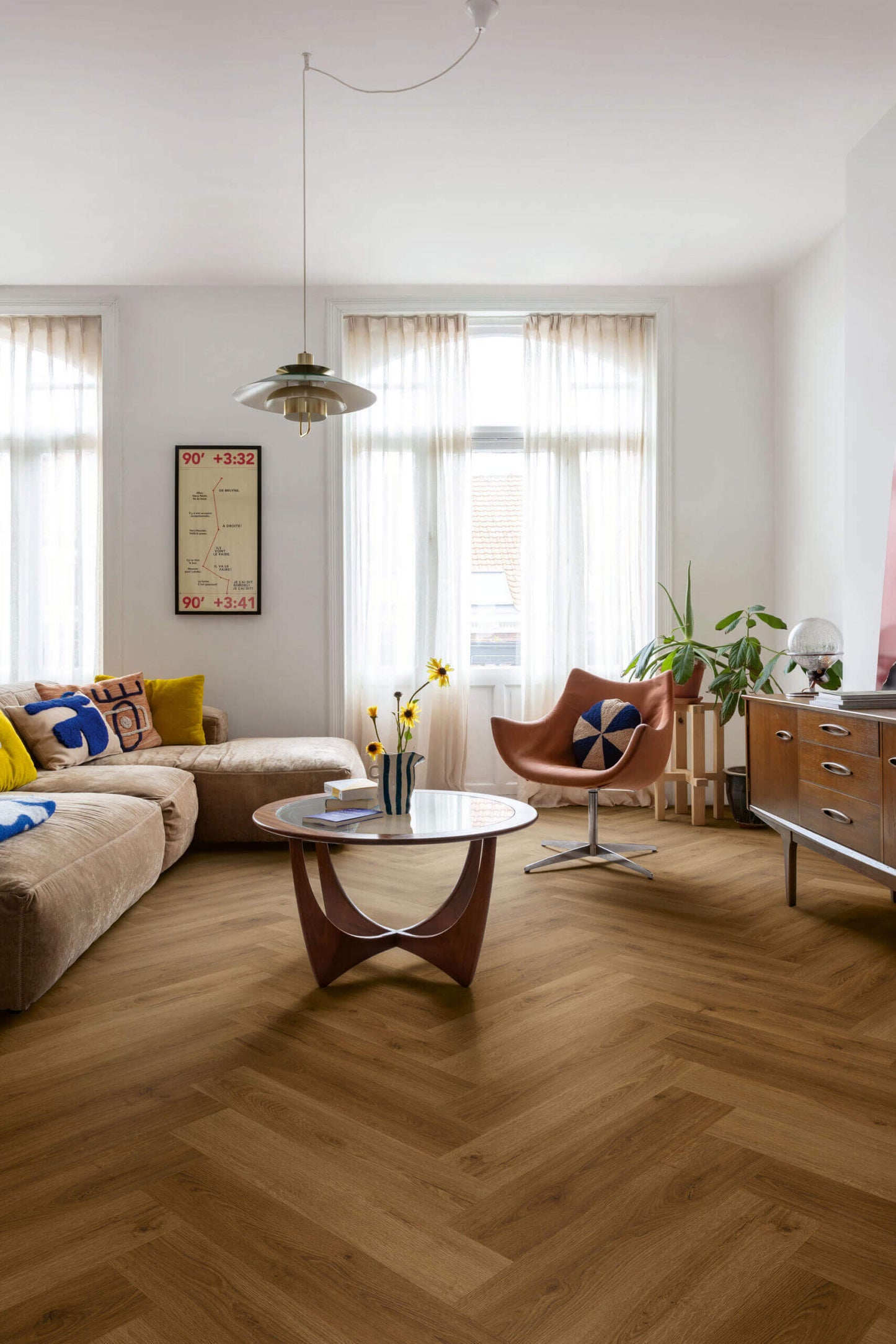 Modern living room with a sectional sofa, coffee table, and decorative items.