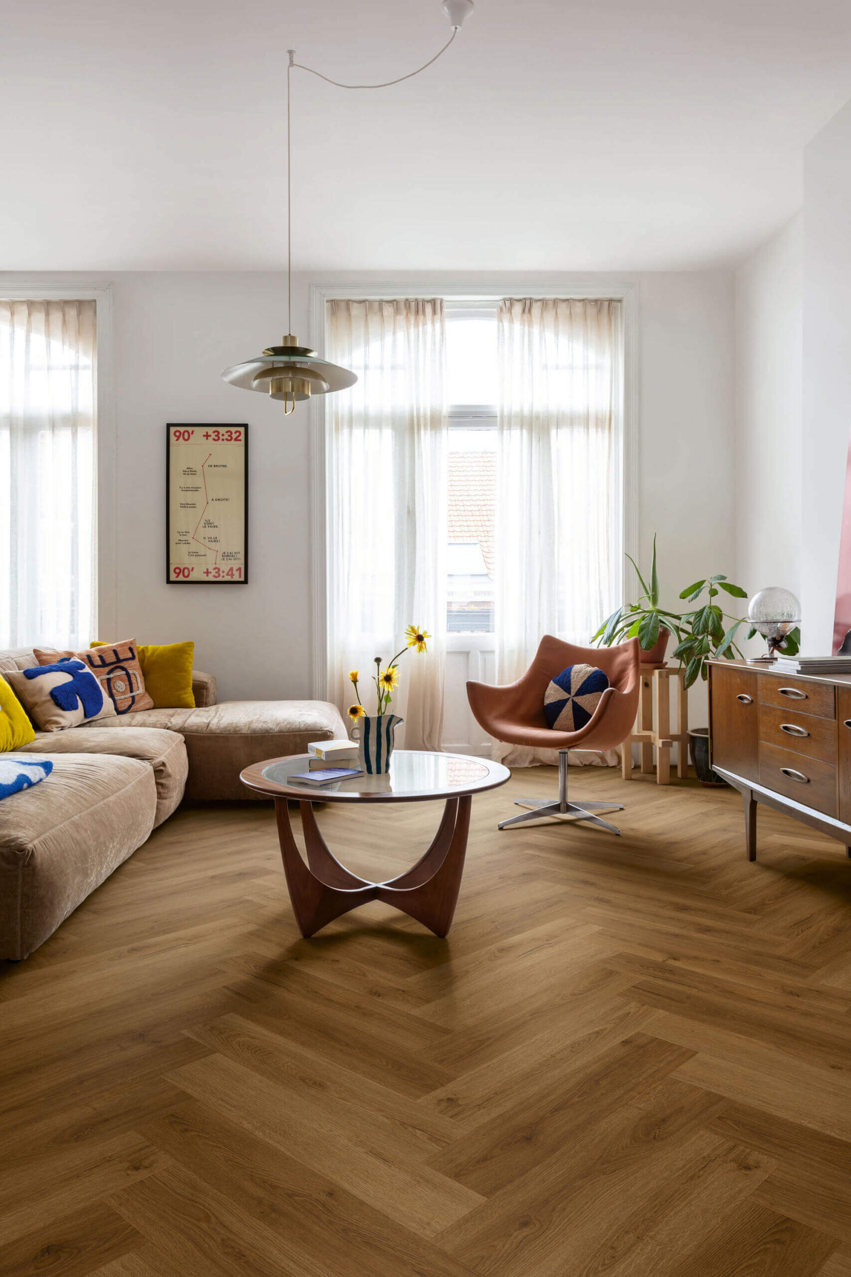 Modern living room with a sectional sofa, coffee table, and decorative items.