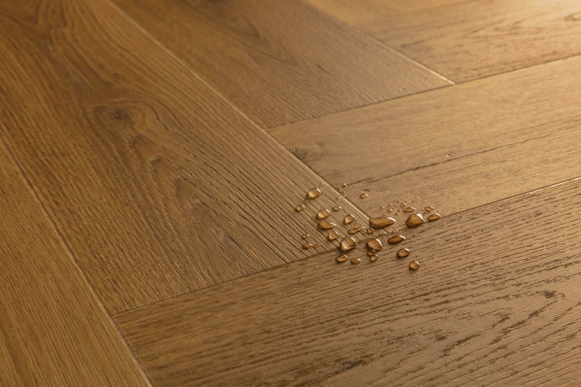 Wooden floor with water droplets on a close-up shot