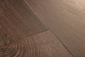 Close-up of a wooden floor with a brown finish
