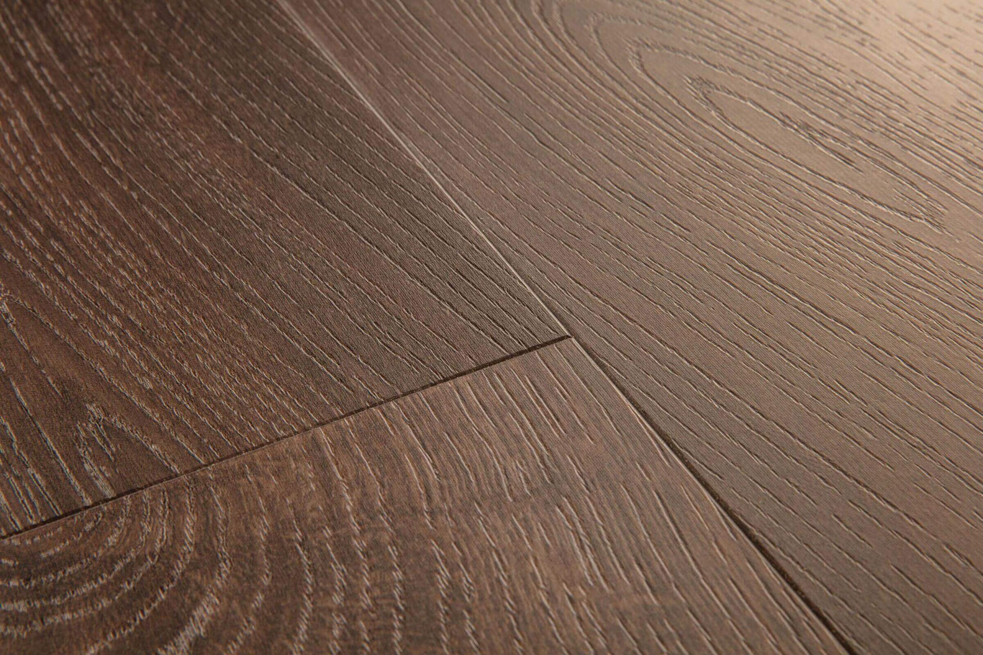 Close-up of a wooden floor with a brown finish
