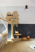 Children's room with wooden furniture, toys, and a black accent wall.