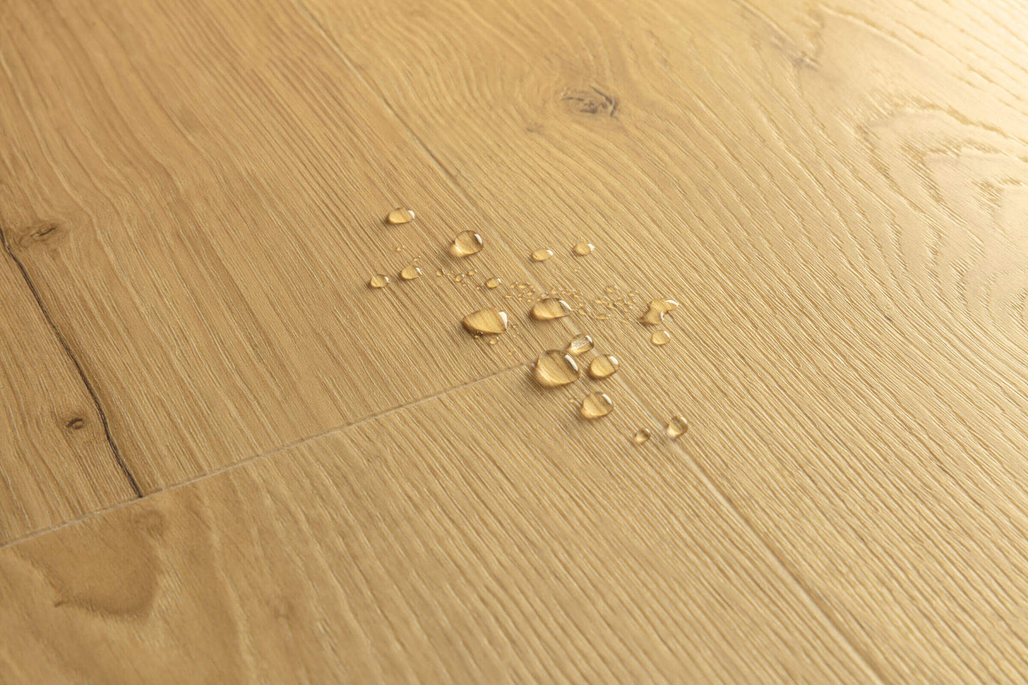 Wooden floor with water droplets on it