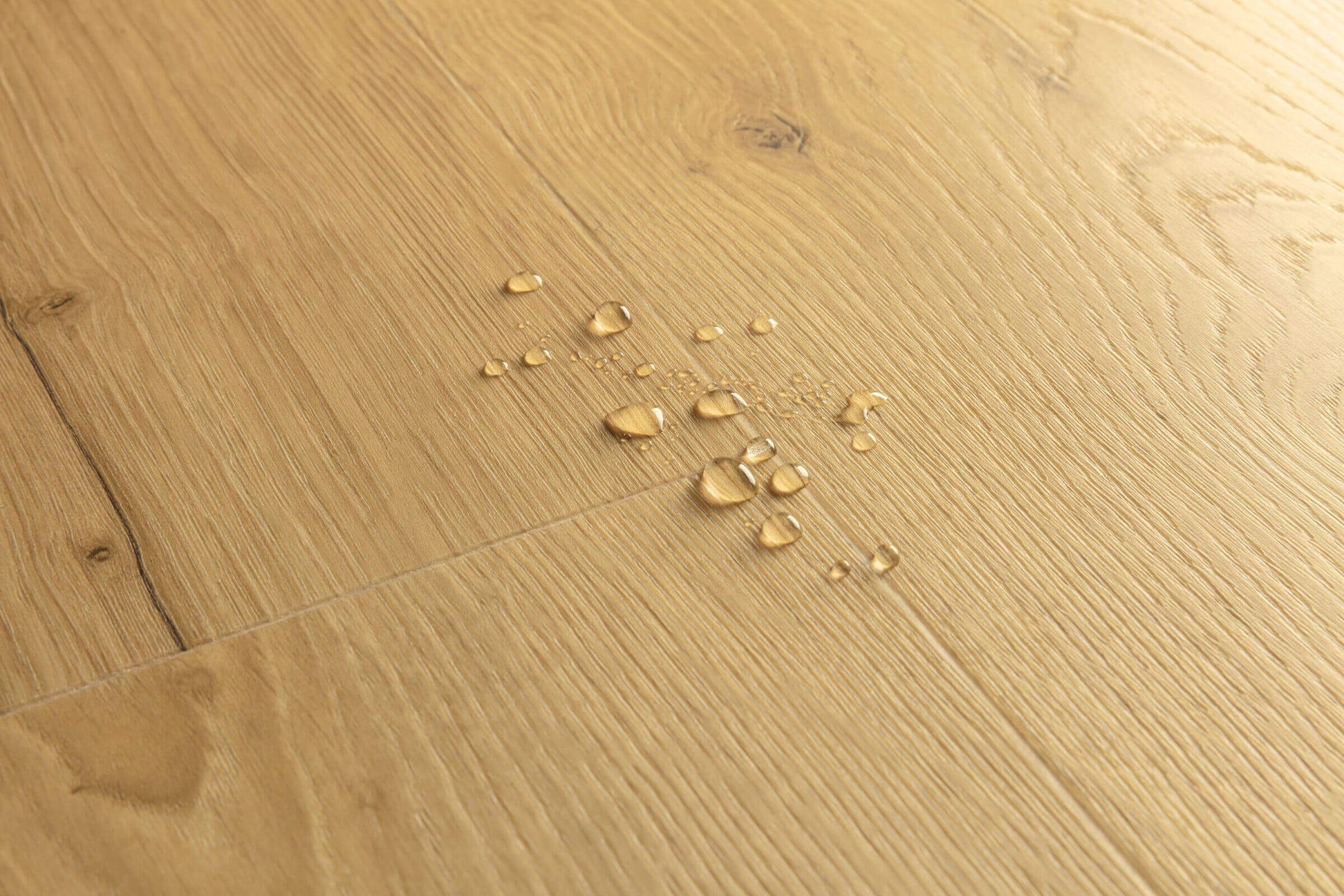 Wooden floor with water droplets on it