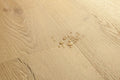 Close-up of a wooden floor with water droplets on it