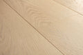Close-up of light wood flooring with visible grain and texture
