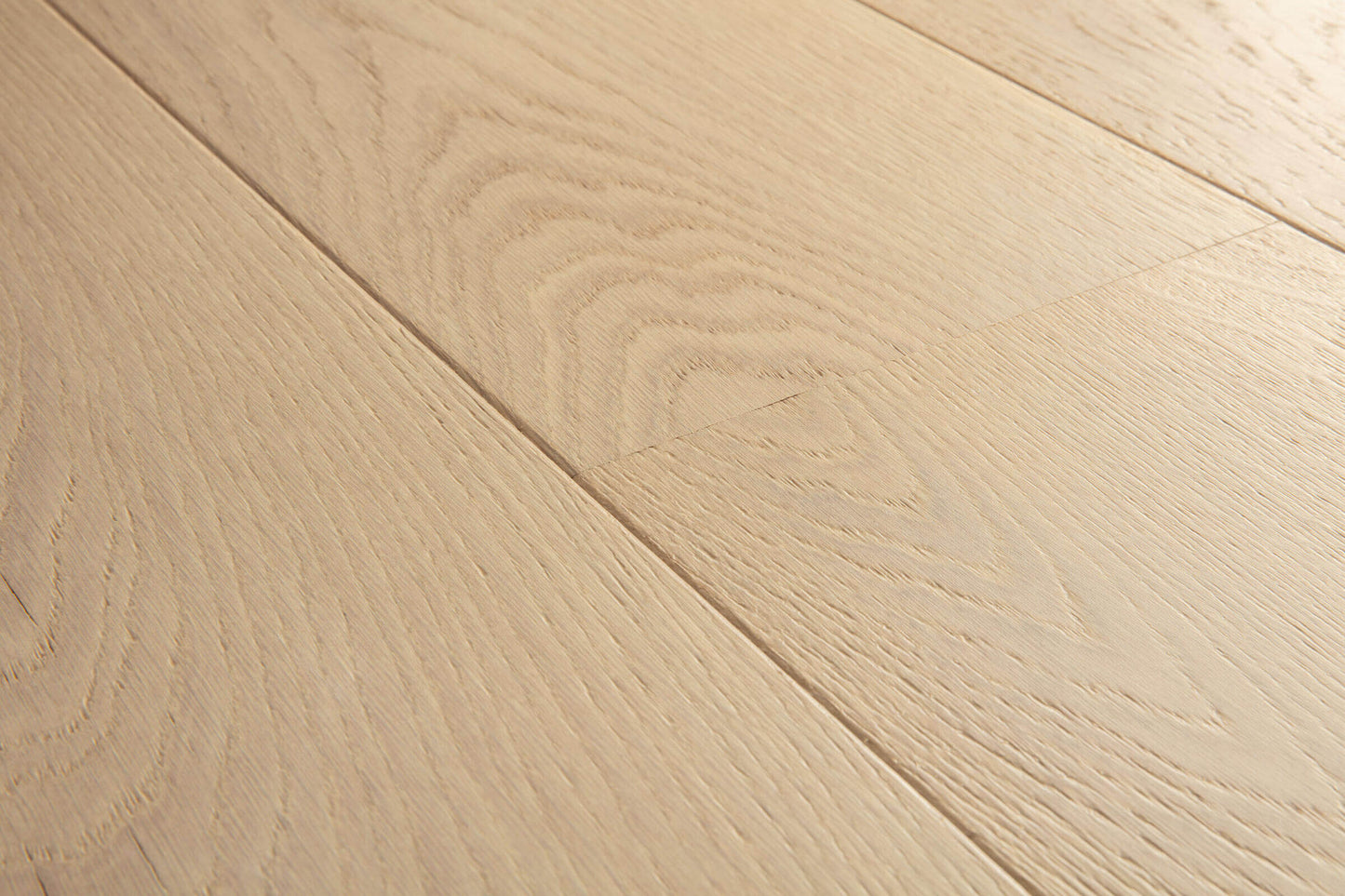Close-up of light wood flooring with visible grain and texture