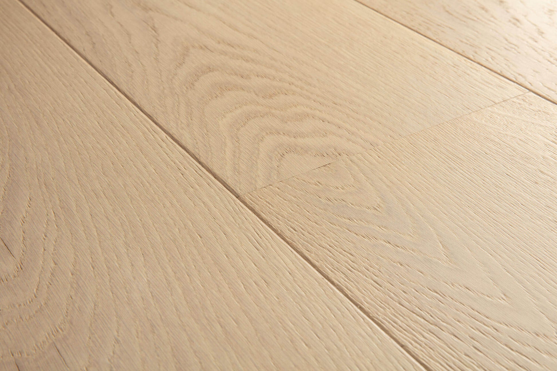 Close-up of light wood flooring with visible grain and texture