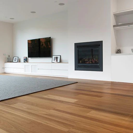 Modern living room with a television, fireplace, and wooden flooring.
