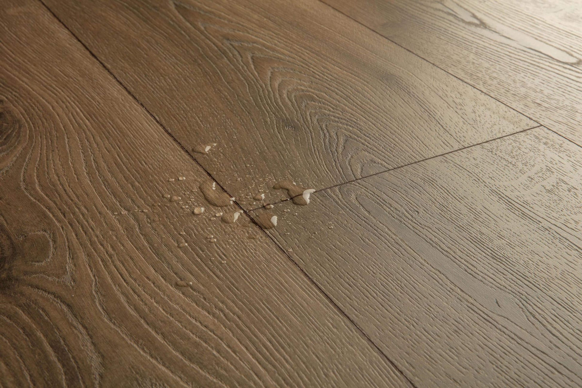 Close-up of a wooden floor with visible grain and texture