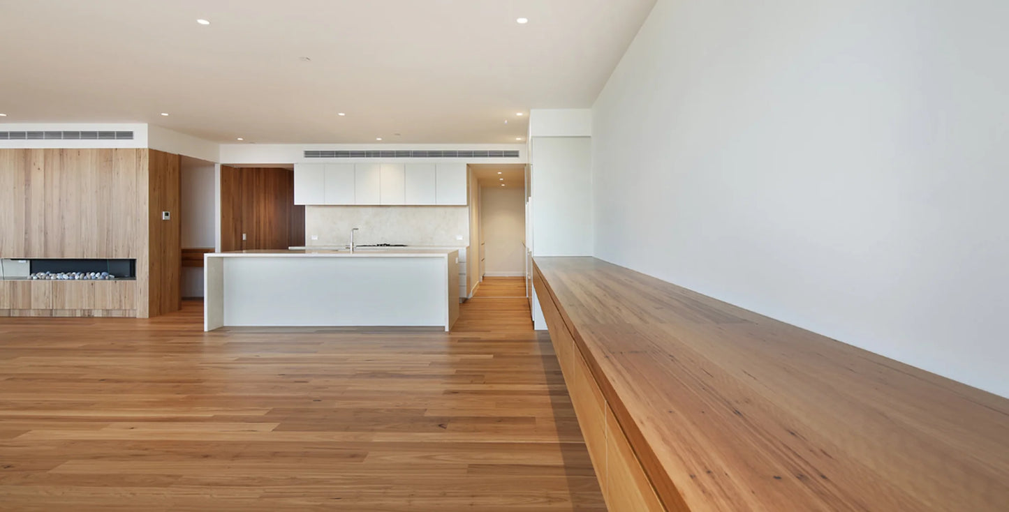 Modern kitchen with wooden floor and white walls