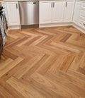 Wooden floor with herringbone pattern in a kitchen setting