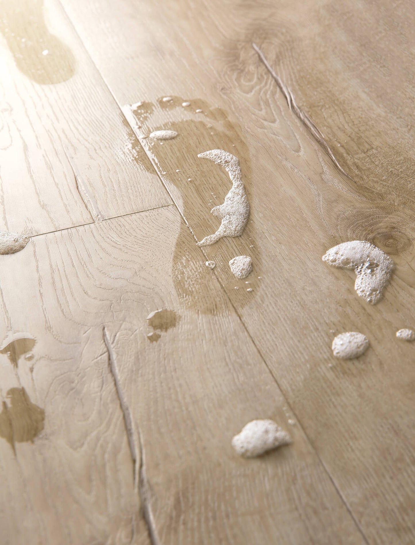 Wooden floor with water damage and foam