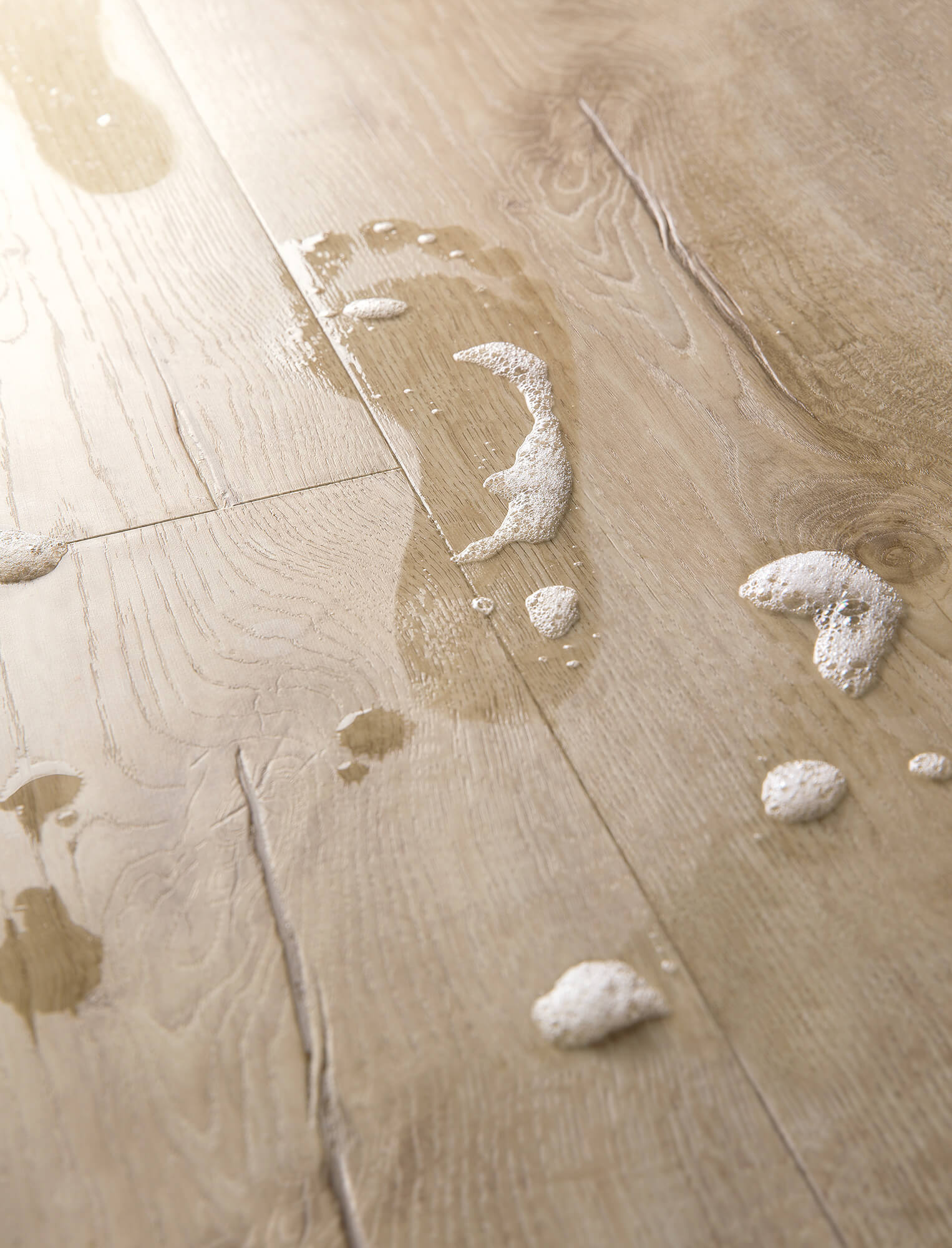 Wooden floor with water damage and foam