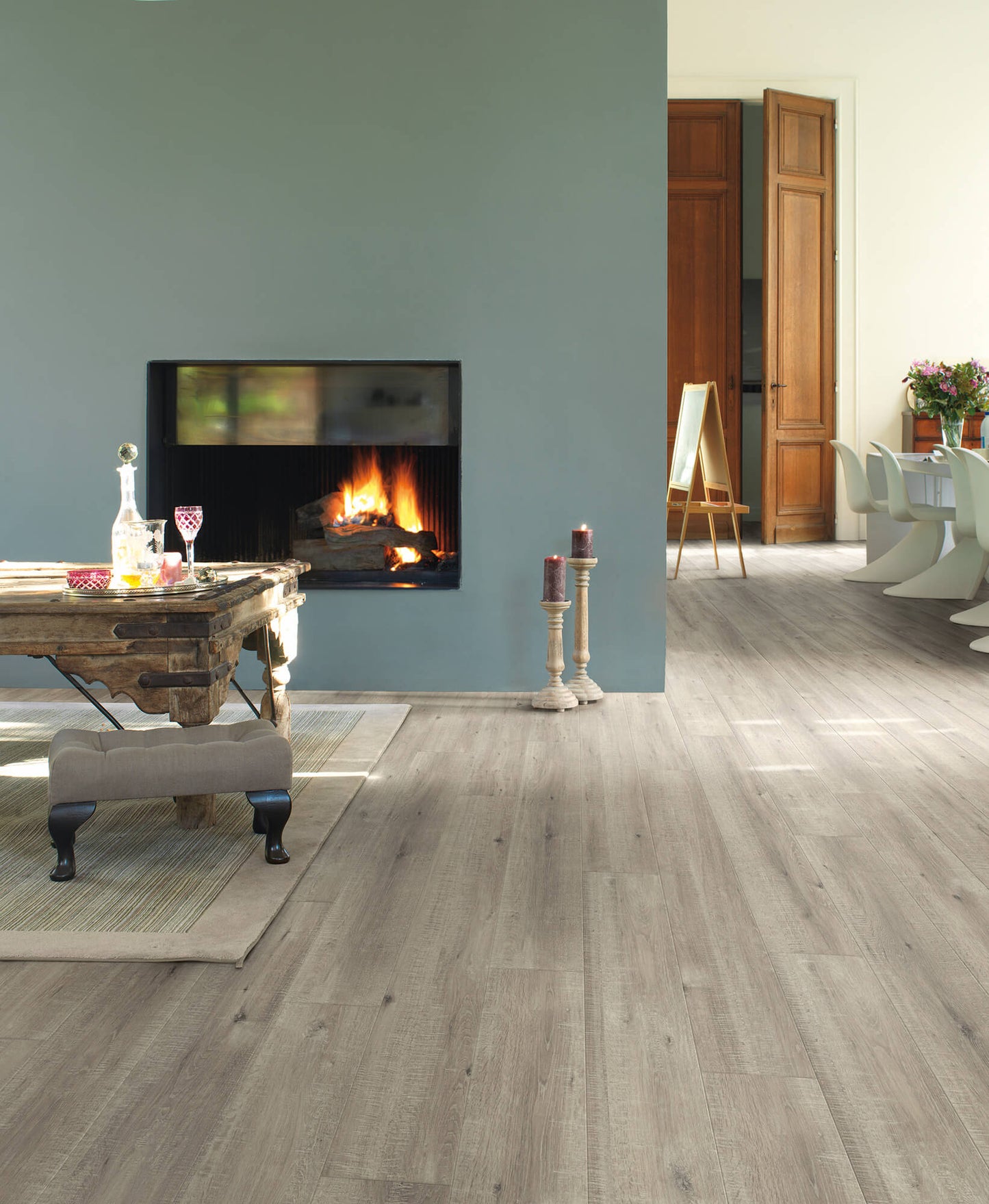 Living room with a fireplace and wooden flooring