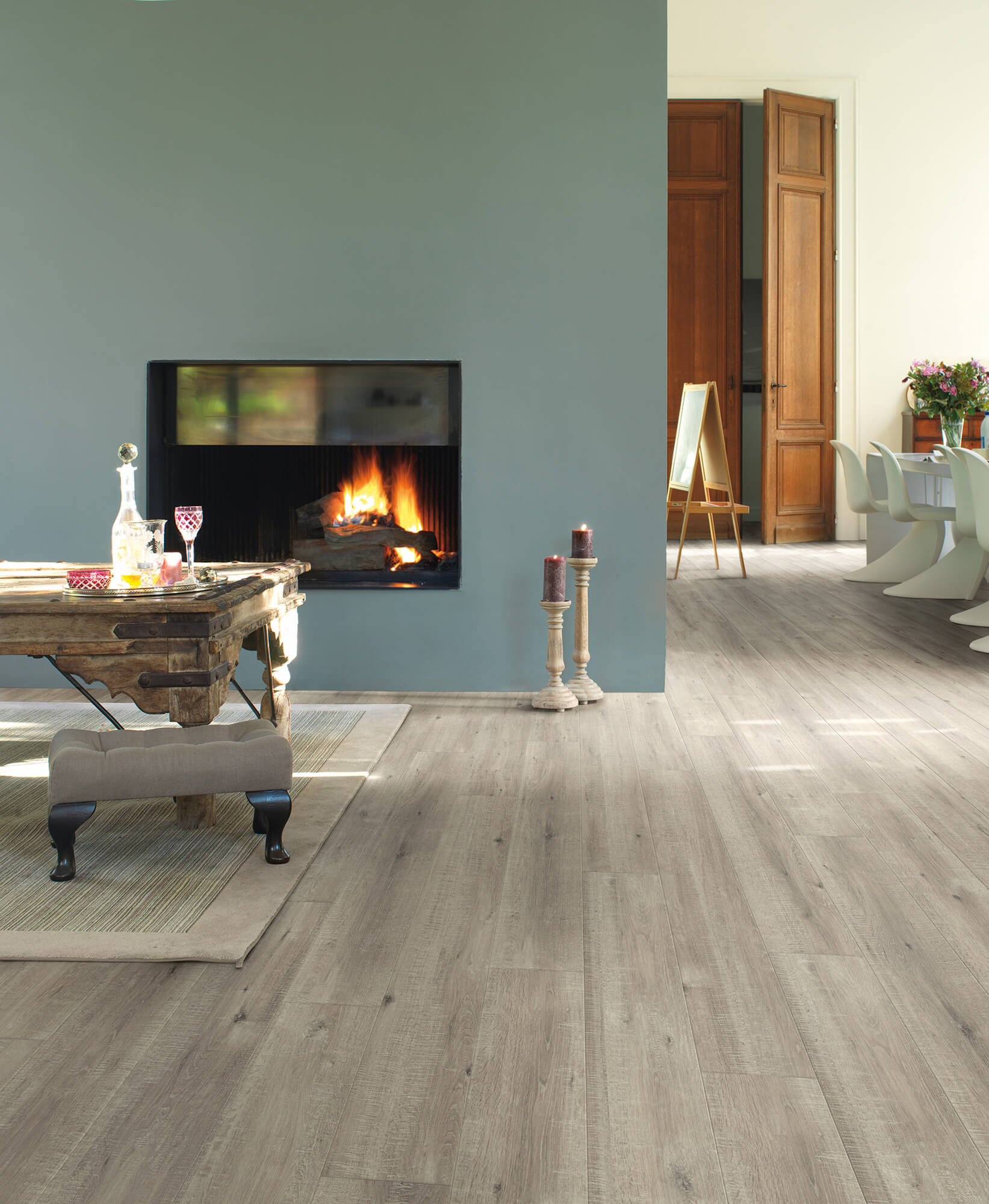 Living room with a fireplace and wooden flooring