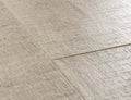 Close-up of a textured beige tile floor