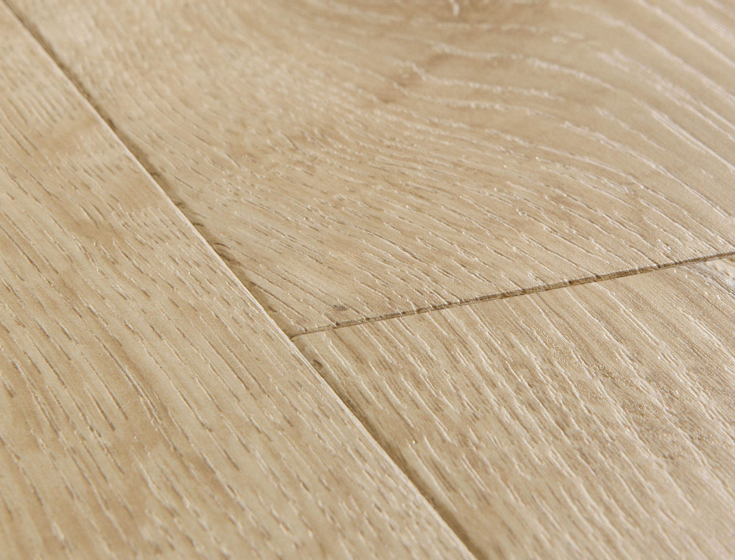Close-up of a wooden floor with light brown planks.