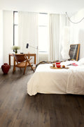 Modern bedroom with a bed, desk, and chair.