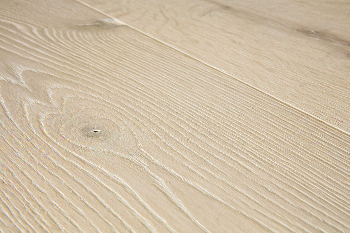 Close-up of a beige wooden surface with visible grain patterns