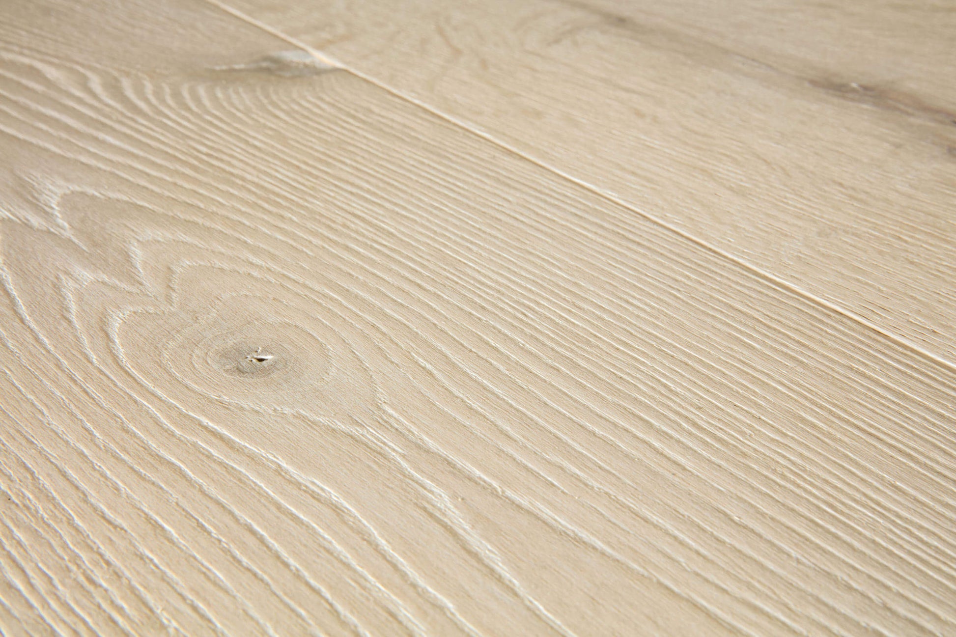 Close-up of a beige wooden surface with visible grain patterns