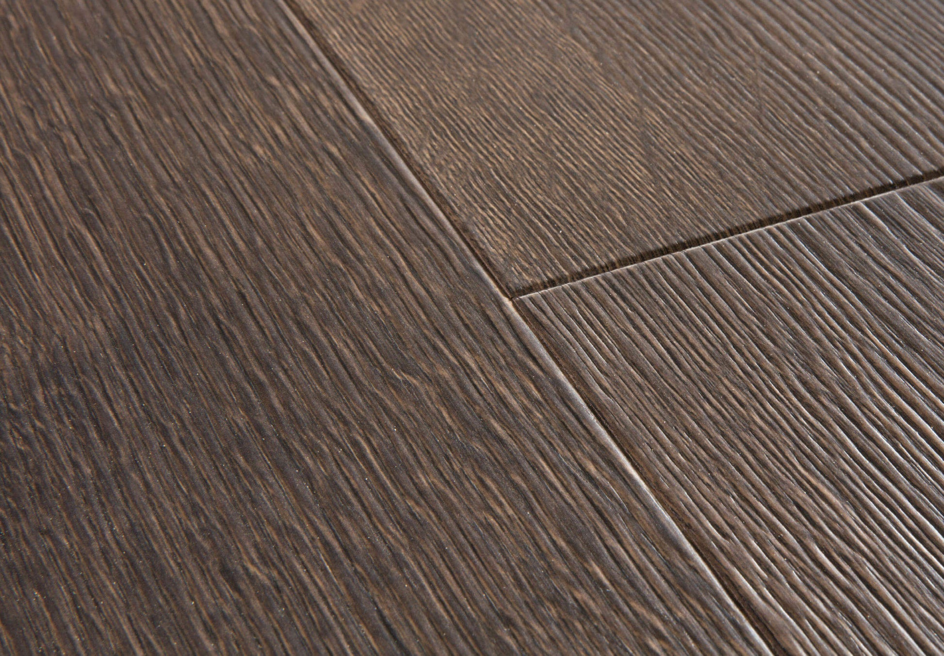 Close-up of dark wood flooring with visible grain and texture