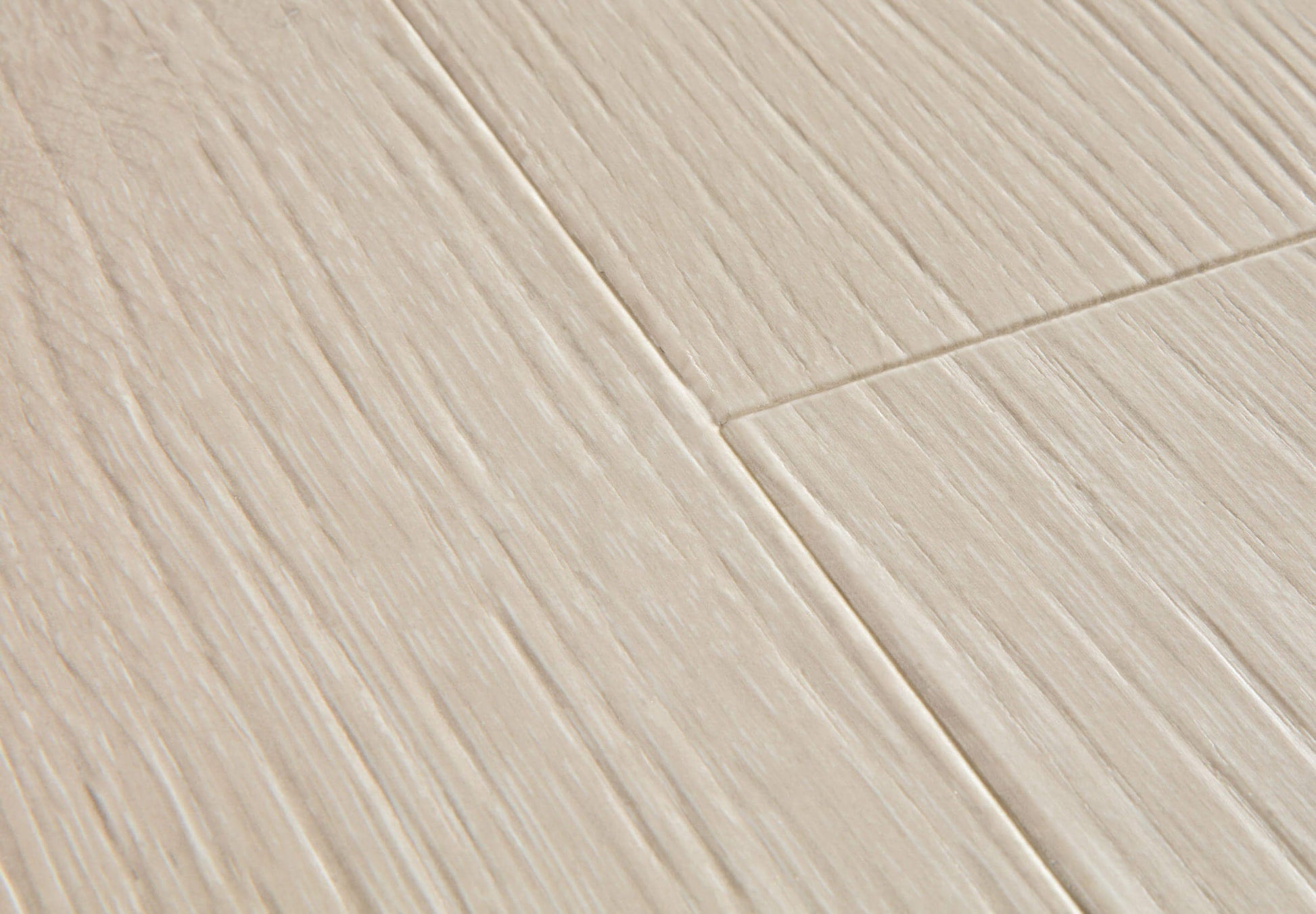 Close-up of a tiled floor with beige tiles