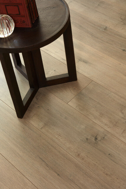 Wooden floor with a dark wooden side table.