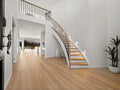 Modern staircase in a home with wooden floor and white walls