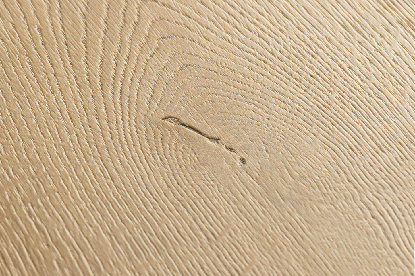 Close-up of a textured beige surface with subtle patterns