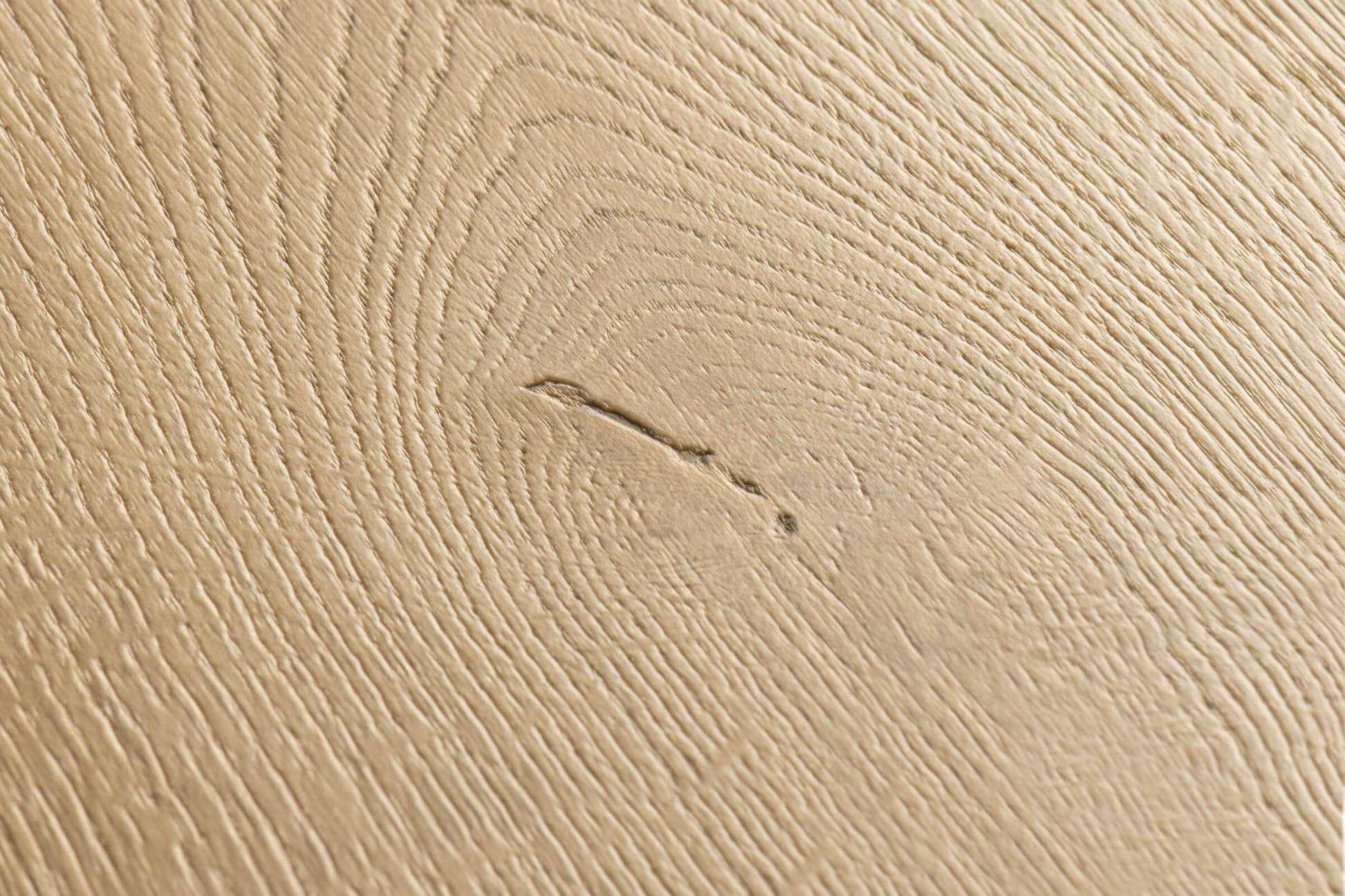 Close-up of a textured beige surface with subtle patterns