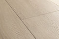 Close-up of a wooden floor with light brown planks.